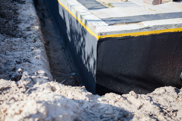 Professional Waterproofing technician working in Auburn, KS